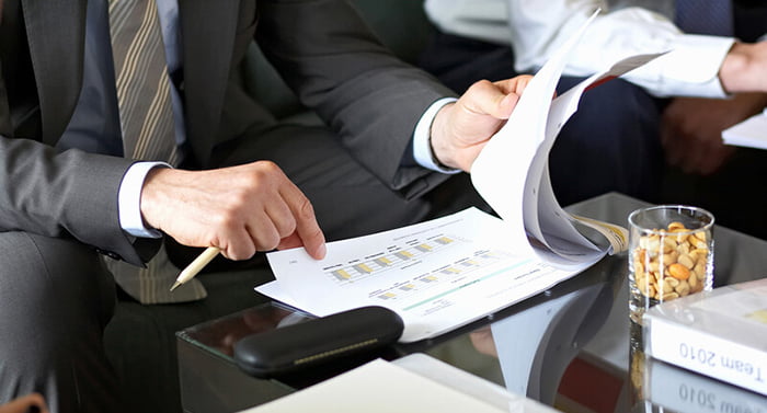 Los Angeles attorneys sitting around a conference table discussing creditor litigation